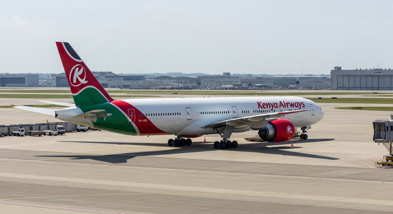 Kenya Airways Boeing 777 passenger jet parked on apron representing leased planes transfer under COMESA review