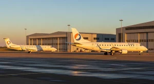 Air Botswana Embraer ERJ-145 and E175 on the apron — government says buyers secured for three grounded jets.